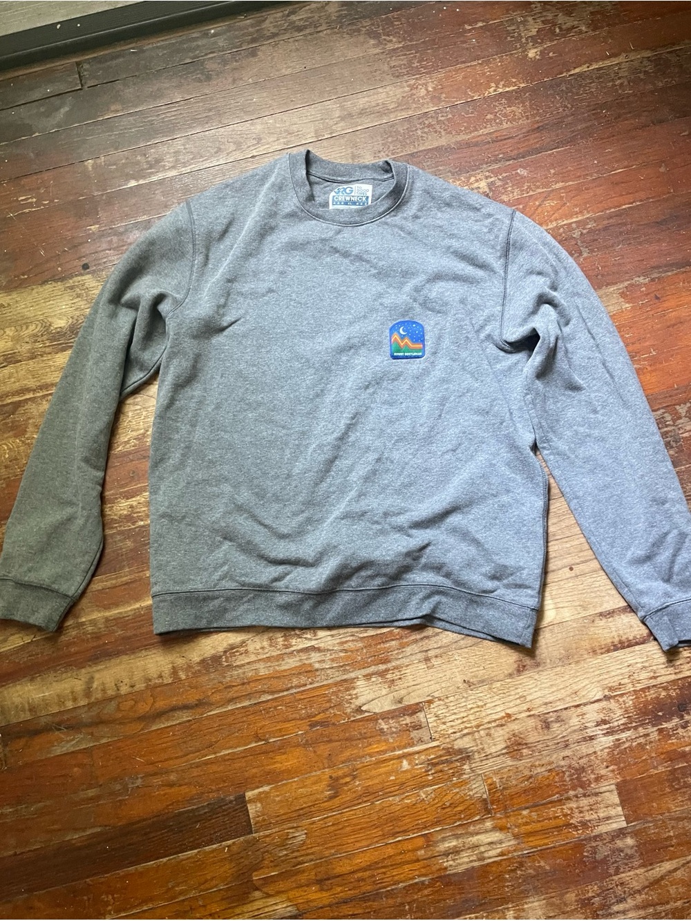 Classic Gray Crewneck Sweatshirt with Small Patch